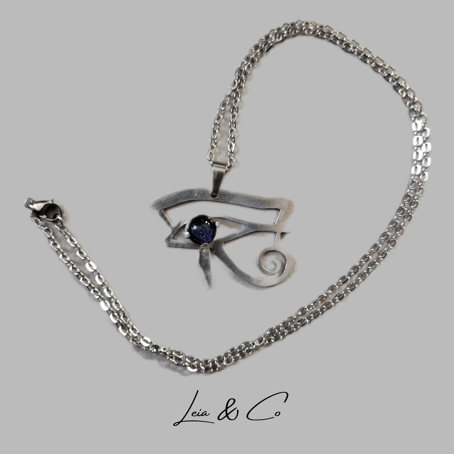 Pendentif symbole égyptien oeil d'Horus argenté et bleu LEIA&CO