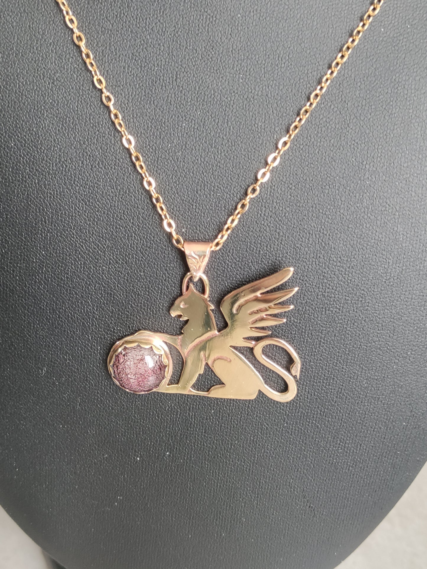 Golden Griffon pendant with red-pink dichroic glass globe LEIA&CO